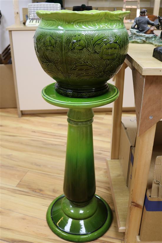 A Victorian Staffordshire green glazed jardiniere on a green pedestal H.89cm